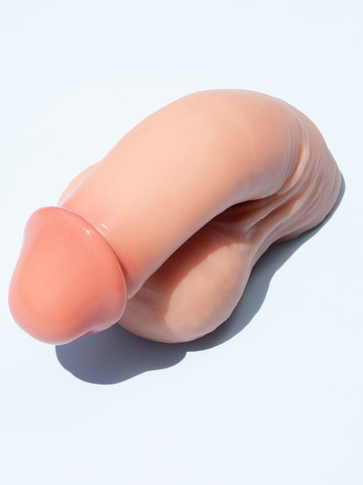 Archer Silicone prosthetic Packer - cashew on white background