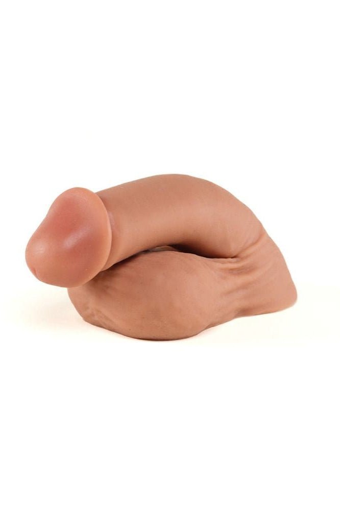 Silicone mold shaped like a trans prosthetic on a white background