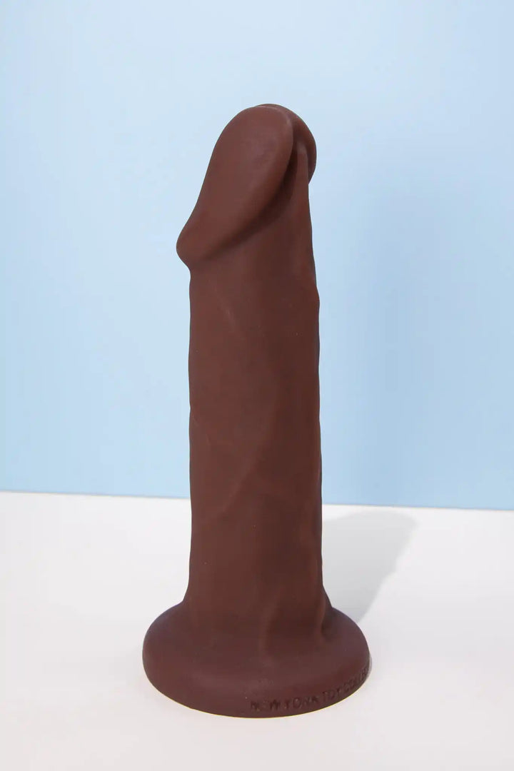 Carter realistic silicone pack and play with posable core shown in chocolate design by New York Toy Collective