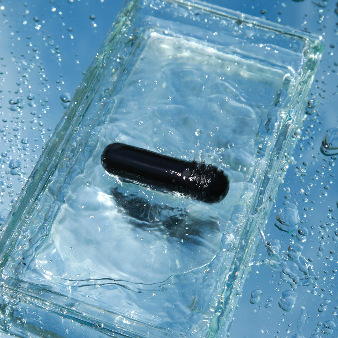 Close-up of black rechargeable bullet vibrator